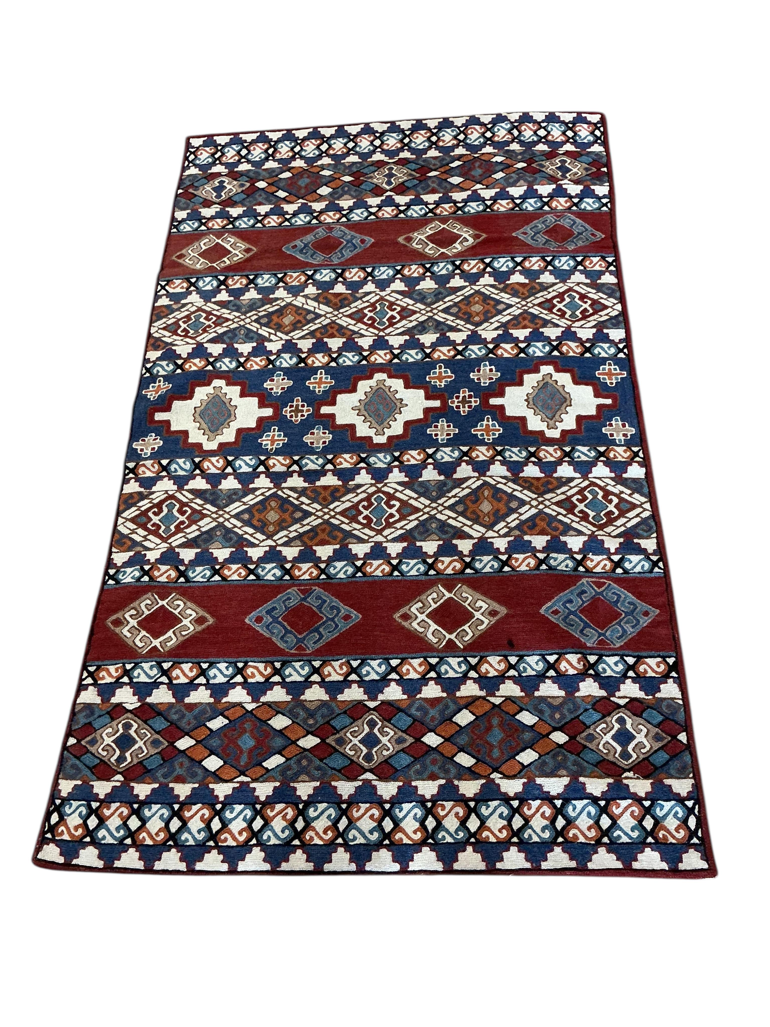 An Afghan red ground rug, a Kilim rug and a Caucasian rug, largest approx. 200 x 110cm